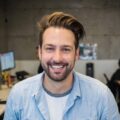 Smiling man in casual shirt at office