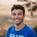 Smiling young man in blue T-shirt